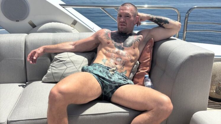Conor McGregor sitting on his yacht