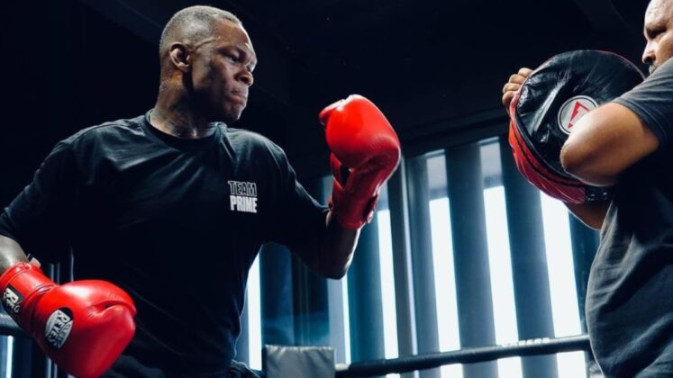 Israel Adesanya hitting pads